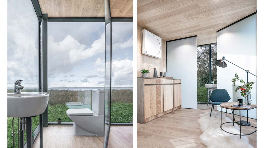 Contemporary bathroom with large glass windows showcasing a scenic outdoor view, featuring a sleek toilet and minimalist design.