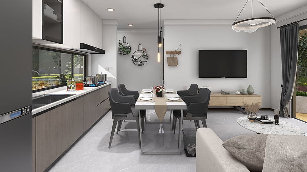 Modern open-plan kitchen and dining area with set table, gray chairs, large window, TV, and sofa in adjoining living space.
