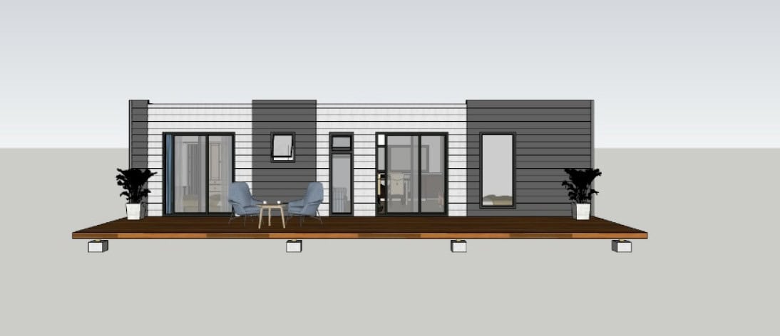 Modern single-story house with horizontal siding, glass doors, potted plants, and a deck with a small table and two chairs.