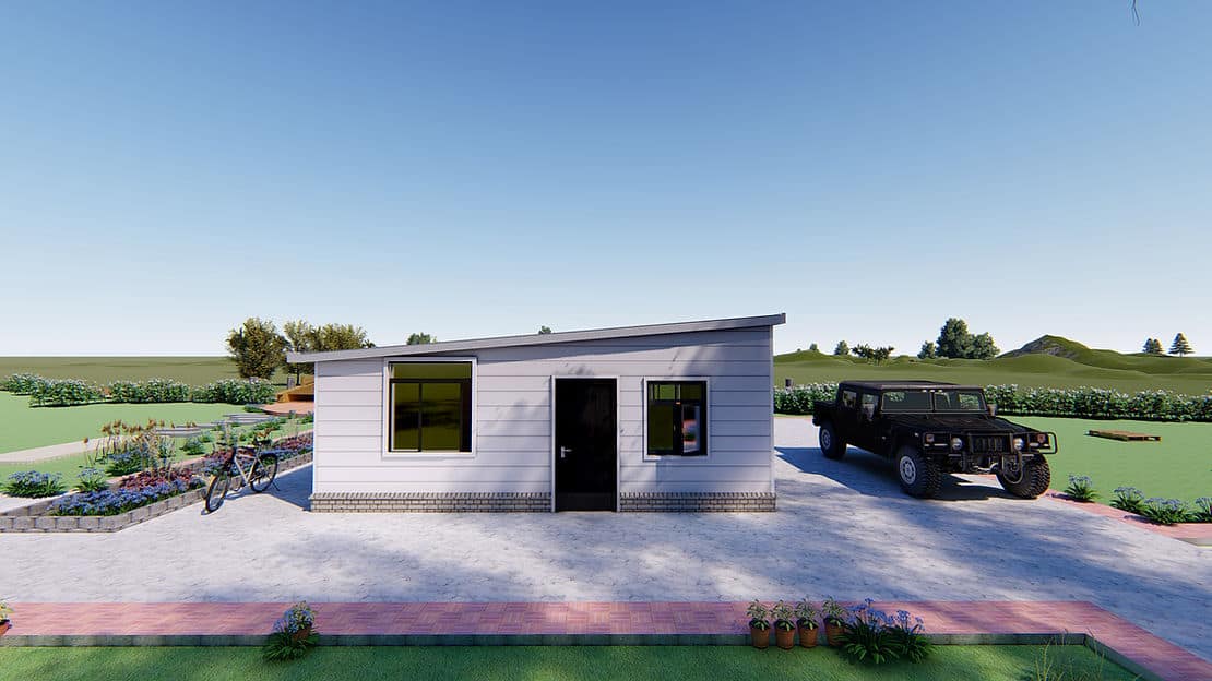 Small white house with slanted roof, two windows, black door; paved area, black SUV, and two bicycles nearby.