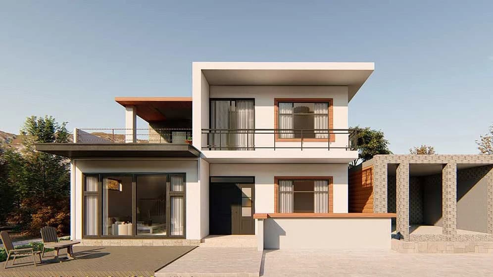 Modern two-story house with large windows, balcony, white and wood accents, outdoor seating, and a stone structure in front.
