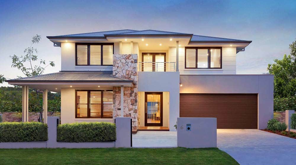 Modern two-story house with large windows, stone trim, double garage, and landscaped yard at sunset.