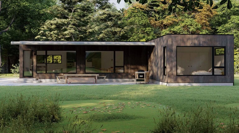 Modern single-story house with large windows and flat roof, surrounded by grass and trees in daylight.