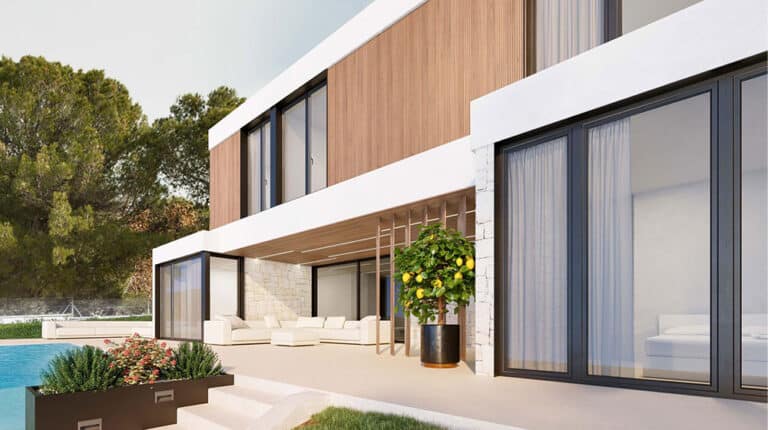 Modern two-story luxury villa with glass doors, wood and white exterior, poolside seating, potted plants, lush greenery.