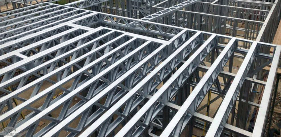 Steel framework of a building under construction with interconnected beams and columns forming its skeleton.