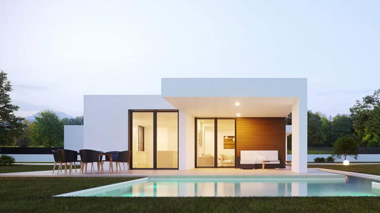 Modern one-story house with glass doors, covered patio, outdoor seating, and a pool in front.