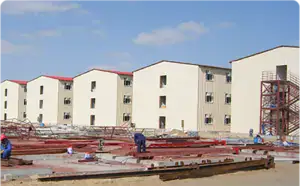 Modern multi-story construction site with prefabricated buildings, showcasing innovative building techniques for affordable housing solutions.