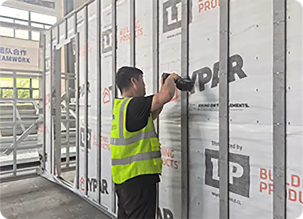 High-quality insulation installation worker attaching thermal insulation panels to building wall for energy efficiency and thermal regulation.