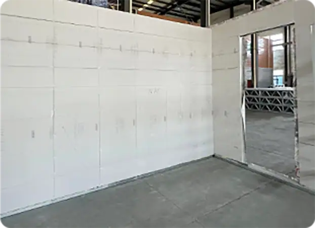 Insulated drywall installation in a construction site, showcasing energy-efficient interior wall solutions for modern homes.