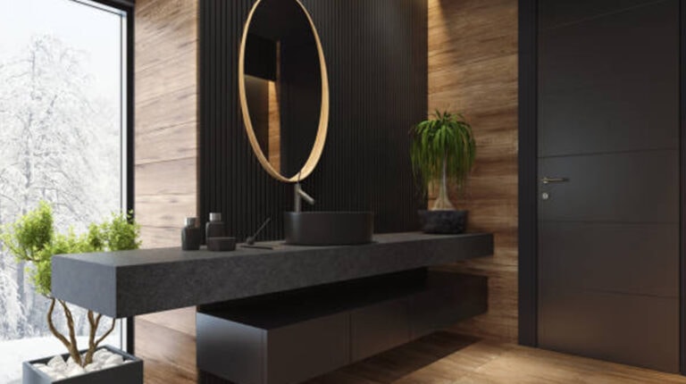 Contemporary bathroom vanity with black sink, circular mirror, and wooden wall accents creating a modern, sleek interior design. Perfect for luxury home decor and stylish bathroom setups.