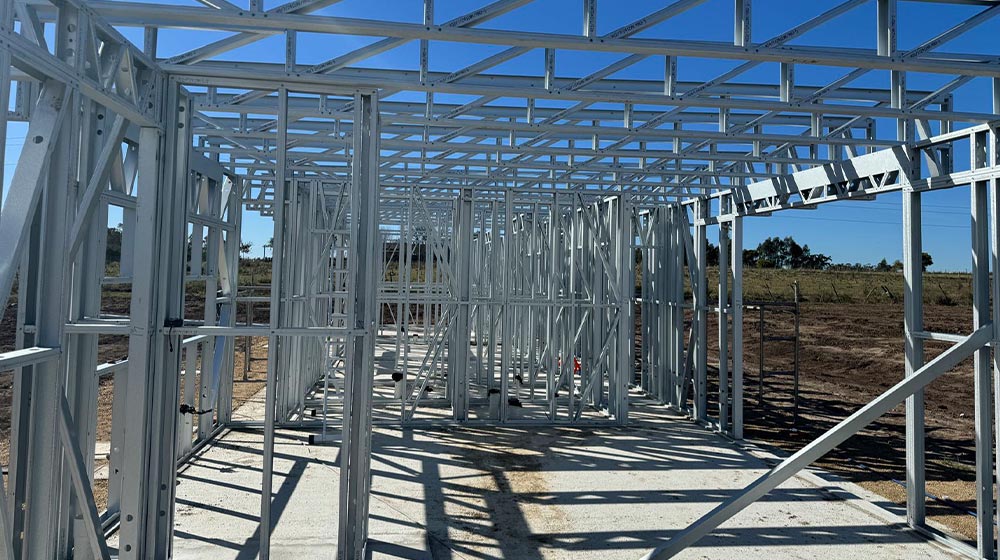 1. Steel framing construction for a modern building under development, showcasing durable steel structure, industrial design, and construction site in progress.