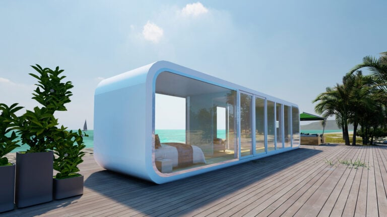 Contemporary oceanfront Tiny Home with glass walls and sleek design, perfect for beach living by the water.