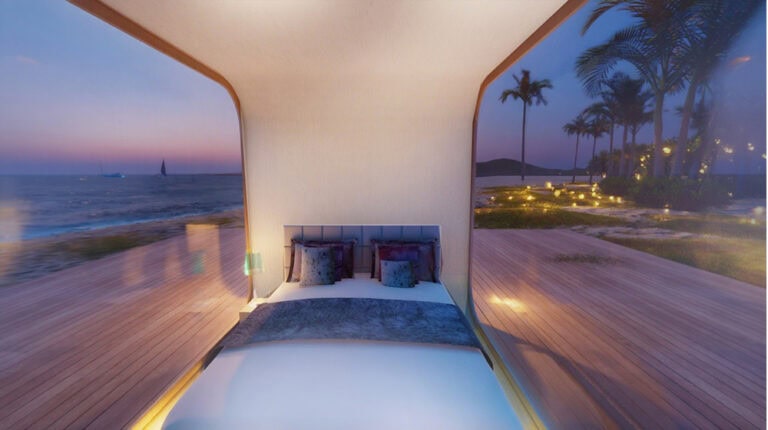 Bright, luxurious bedroom overlooking the ocean with large windows, stylish decor, and palm trees, perfect for a relaxing coastal retreat. Experience comfort with stunning sunset views and outdoor surroundings.