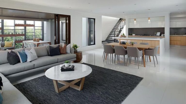 Bright, open-concept living space with contemporary furniture, large windows, and clean design in a luxury home. Perfect for relaxing and entertaining in style.