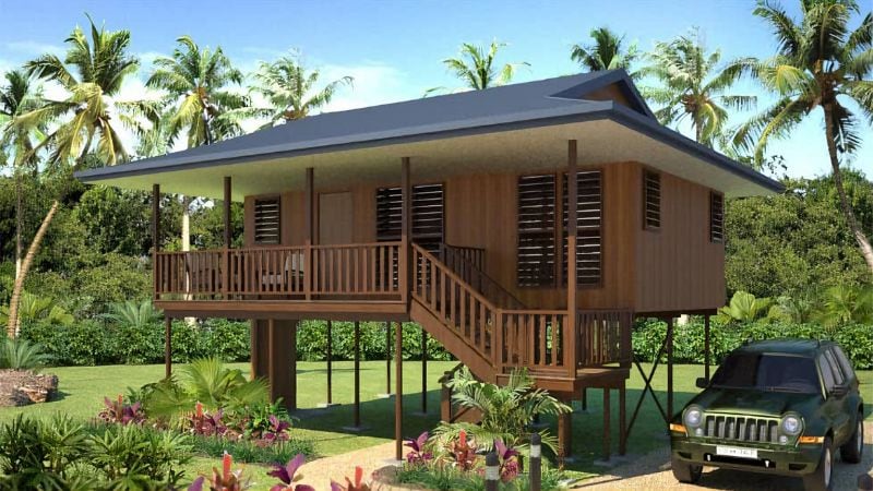 Wooden stilt bungalow with tropical surroundings