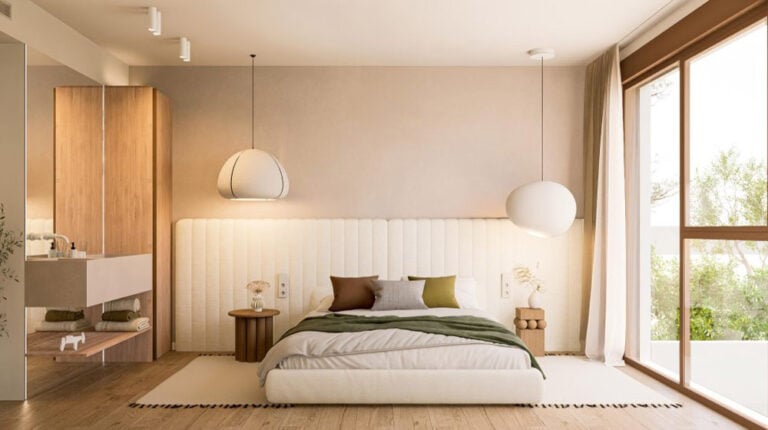 Bright and airy bedroom in Suva House featuring a large window, neutral tones, and minimalist decor for a relaxing atmosphere.