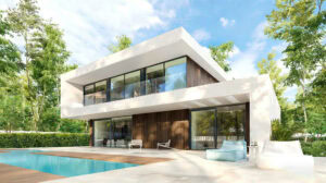 Modern Teruel House with pool, expansive glass windows, and contemporary architectural design in a lush green setting.