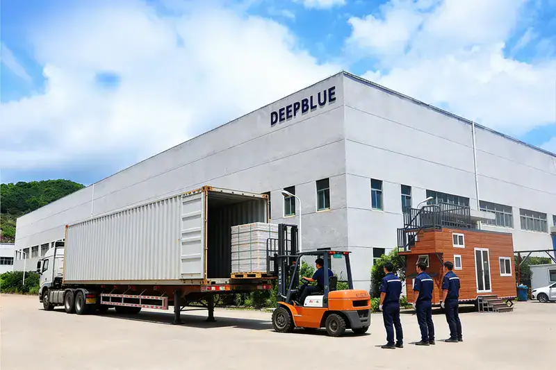 Modern Deepblue manufacturing plant with loading dock, forklift, and staff, showcasing advanced industrial operations and logistics.