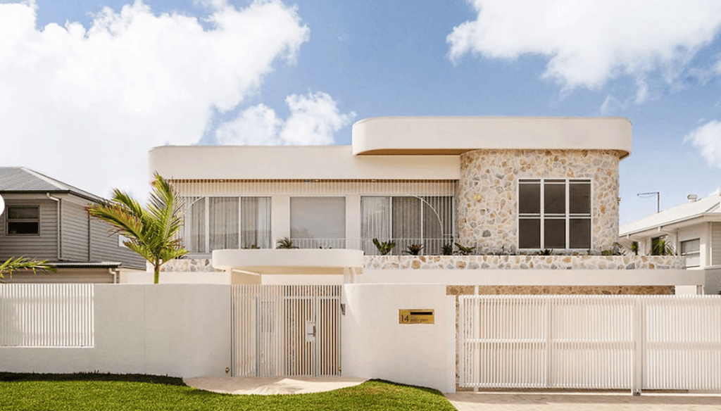 Contemporary prefab house with sleek design, stone accents, and large windows, showcasing fast construction and resilience for global residential projects.