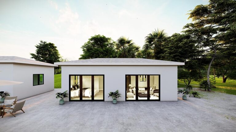 Contemporary minimalist house featuring large glass sliding doors, surrounded by lush trees and outdoor patio, ideal for modern living and outdoor relaxation.
