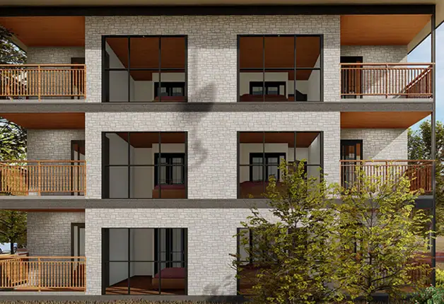 Contemporary apartment building featuring spacious glass balconies, wooden railings, and a sleek brick exterior, set amidst lush trees for a stylish urban living environment.