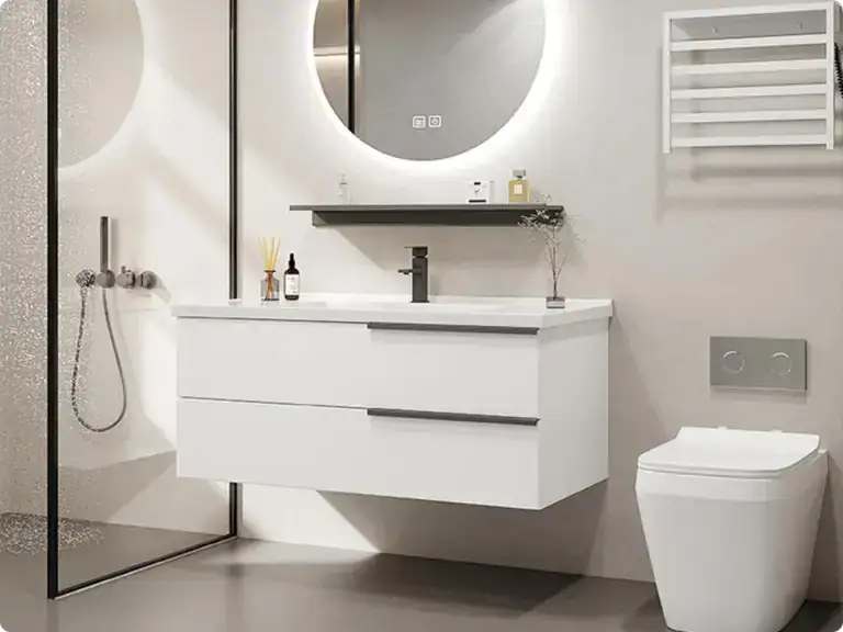 Modern minimalist bathroom featuring a sleek white vanity with integrated sink, a large round illuminated mirror, and contemporary fixtures for a clean, stylish look.