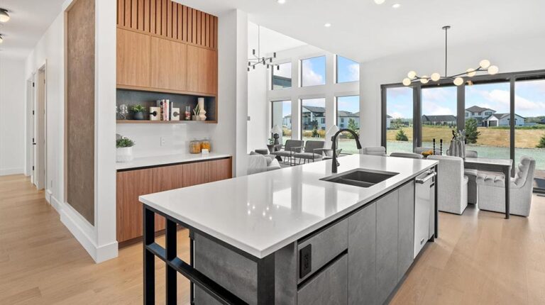 Bright and spacious Nantes house interior with open-plan kitchen and living room, featuring large windows, contemporary design, and natural light. Perfect for modern living and entertaining.