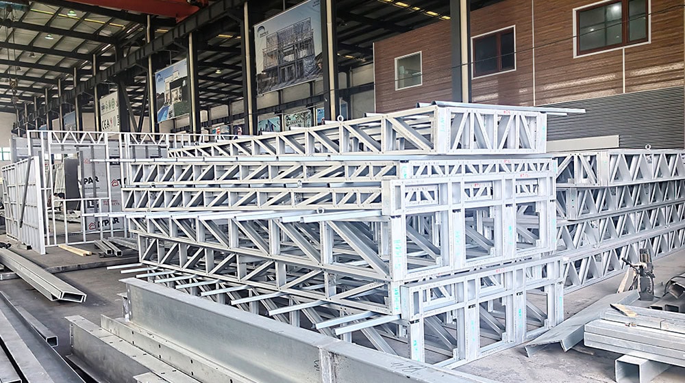 Metal scaffolding and construction materials at a building site, related to the Gold Coast House project.
