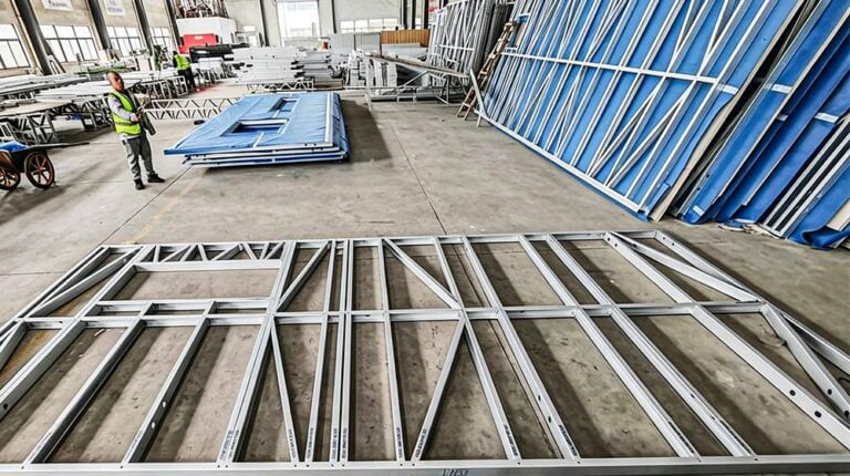 Steel framing components for the Deepblue panelized system in a manufacturing facility, ready for assembly.