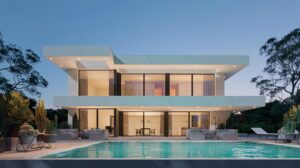 Contemporary luxury home featuring a sleek design, large glass windows, and an inviting swimming pool, perfect for modern living and outdoor relaxation.