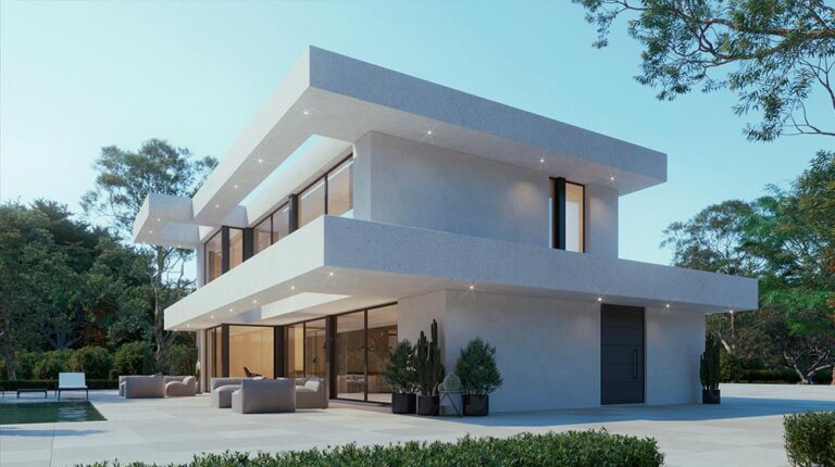 Modern white two-story house with expansive glass windows, outdoor seating, and lush greenery, showcasing contemporary architecture and outdoor living space.
