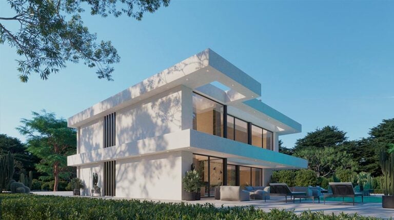 A contemporary white villa featuring sleek architectural design with large glass windows, spacious balconies, and an outdoor seating area surrounded by lush greenery and tall trees.