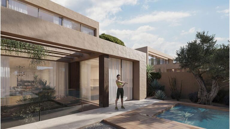 Contemporary residential building with large glass windows, outdoor pool, and landscaped garden, showcasing modern architecture and outdoor living space.
