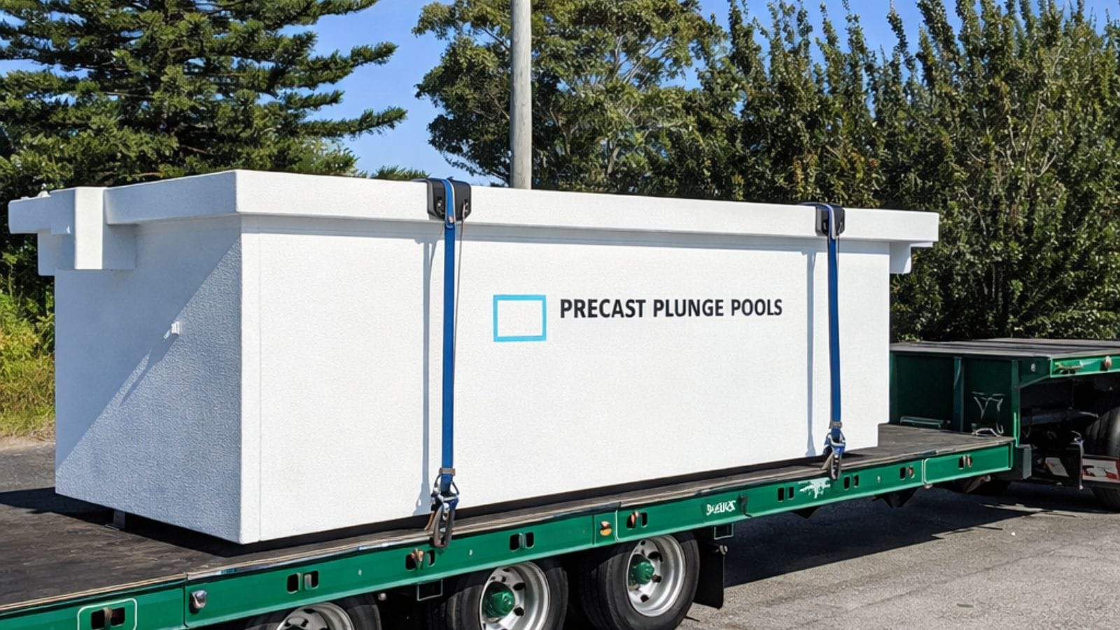 a precast pool on a flatbed truck for transportation